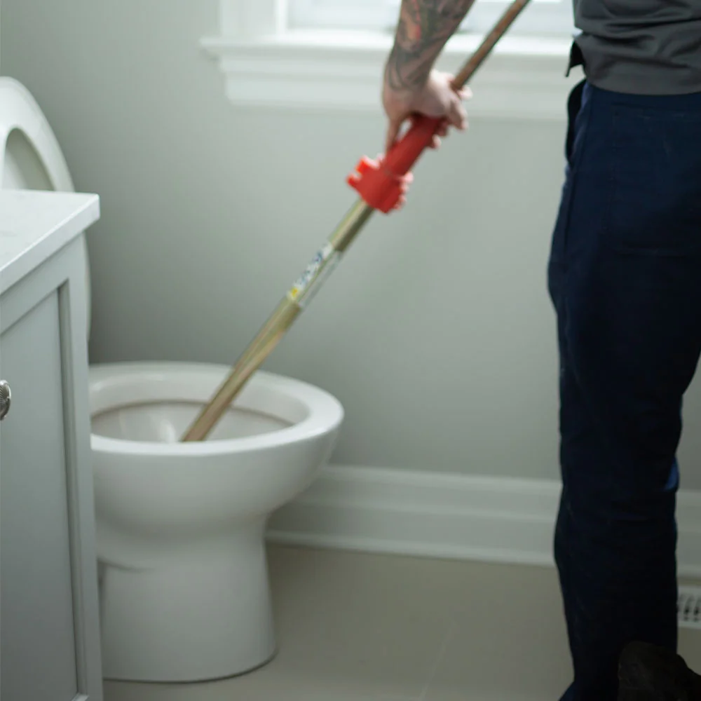 burlington plumber fixing clogged toilet